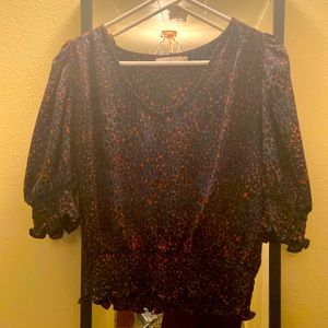 Super fun, sexy blouse with lightly puffed shoulders.